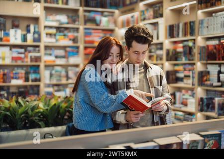 Young couple browsing books together in bookstore Stock Photo