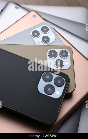 Many different modern gadgets on wooden table Stock Photo