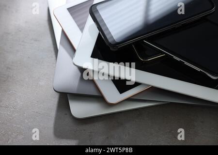 Many different modern gadgets on grey table, closeup Stock Photo