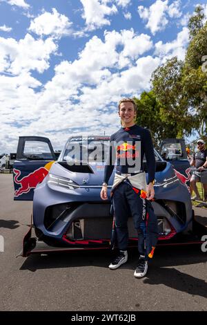 Adelaide, Australia. 16 March, 2024. Red Bull Reserve driver Liam Lawson, stands in front of the Ford Supervan 4.2 before a showdown against a current Gen-3 Supercar driven by James Courtney on Saturday at the 2024 Repco Adelaide Motorsport Festival. Credit: James Forrester/Alamy Live News Stock Photo