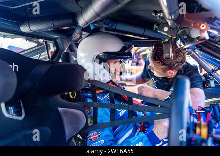 Adelaide, Australia. 16 March, 2024. Former Haas F1 team principle Günther Steiner gets strapped into James Courtney’s Gen-3 Mustang Supercar ahead of a hotlap on Saturday at the 2024 Repco Adelaide Motorsport Festival. Credit: James Forrester/Alamy Live News Stock Photo