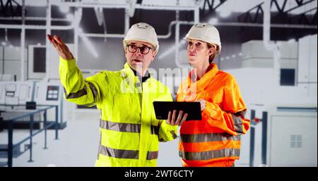 Factory Worker Osha Inspection Using Tablet Computer Stock Photo