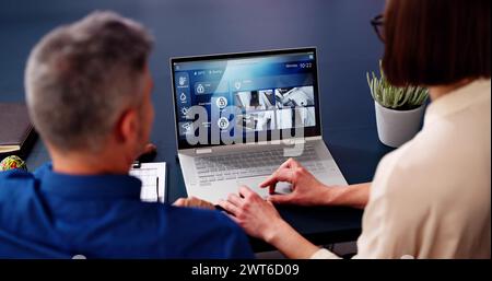 Smart House CCTV Security Camera App On Laptop Stock Photo