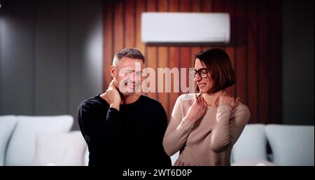 Sick Couple Having Cold And Sore Throat From Air Conditioner Stock Photo
