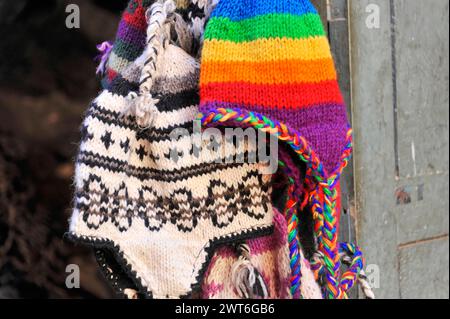 Colourful, hand-knitted woollen hats hanging on a rack, Kathmandu Valley. Kathmandu, Nepal Stock Photo