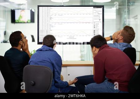 Group, stress and men on computer in office reading coding data, information or research. Frustrated, technology and team of male programmers working Stock Photo