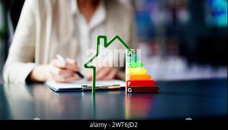 Energy Efficient House Audit Using Calculator. High Efficiency Stock Photo
