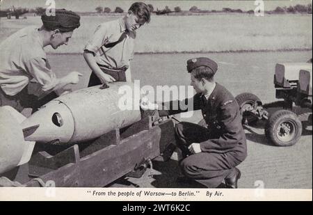 Old black and white photograph of Polish military man writing on a bomb during World War II 'From the people of Warsaw - to Berlin. By Air.' ca. 1939 Stock Photo