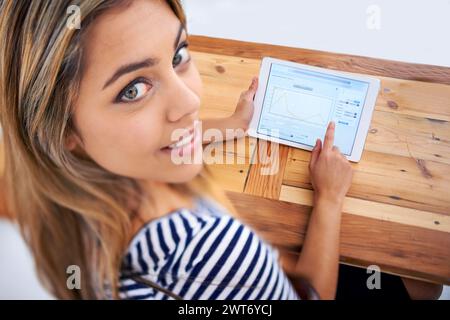 Businesswoman, tablet and portrait with smile, screen and desk and workspace in office. Data analyst, female person and corporate with technology for Stock Photo