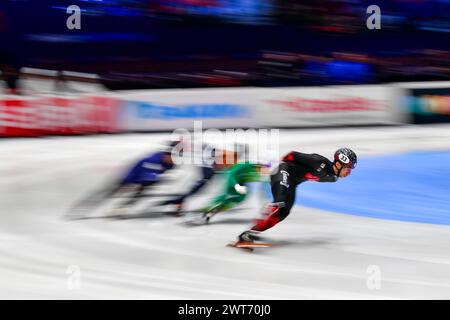 DANDJINOU William CAN leads competing on day 1 during the World Short Track Speed Skating Championship from Rotterdam on 15 March 2024. Photo by Phil Hutchinson. Editorial use only, license required for commercial use. No use in betting, games or a single club/league/player publications. Credit: UK Sports Pics Ltd/Alamy Live News Stock Photo