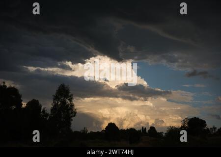 Wide image of large storm clouds in distance Stock Photo