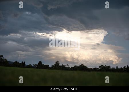 Wide image of large storm clouds in distance Stock Photo