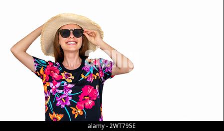 Isolated cheerful woman in sun straw hat and sunglasses looking and smiling. Stock Photo