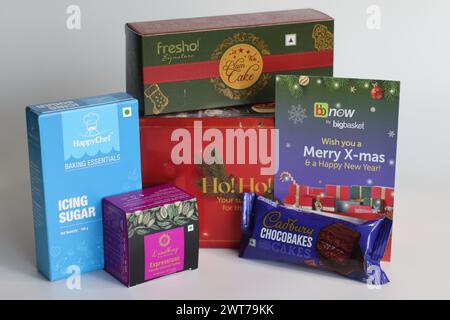 Mumbai, India, December 25 2023: Christmas gifts from online quick delivery grocery store in India, BB now by Big Basket. It includes Christmas cake, Stock Photo