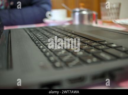 laptop and coffee on the table for surfing the net while sipping the coffee Stock Photo