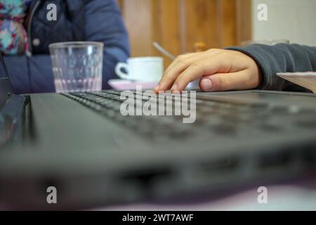 laptop on the table after lunch and while having coffee Stock Photo