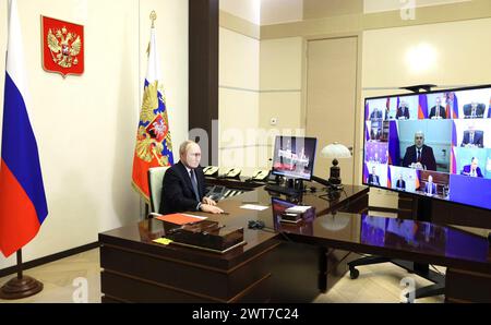 Novo-Ogaryovo, Russia. 15th Mar, 2024. Russian President Vladimir Putin chairs a teleconference meeting with members of the national security council from the official presidential residence, March 15, 2024 in Novo-Ogaryovo, Russia. Credit: Mikhail Metzel/Kremlin Pool/Alamy Live News Stock Photo