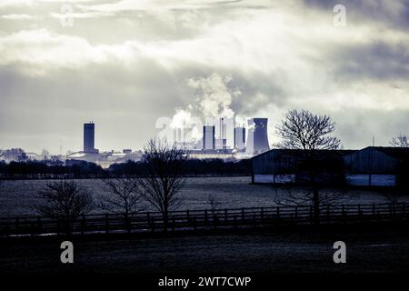 Industrial landscape, view towards Middlesbrough. Power stations, chimneys and cooling towers can be seen in the distance over fields. Stock Photo