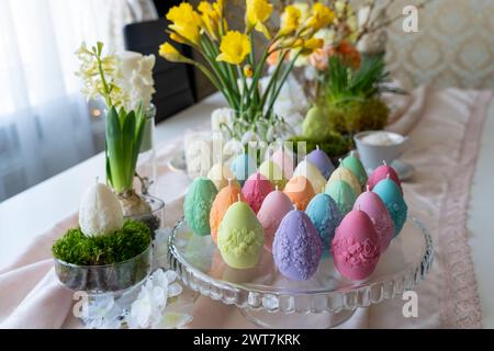 Colorful easter egg soy wax candles. Spring background Stock Photo