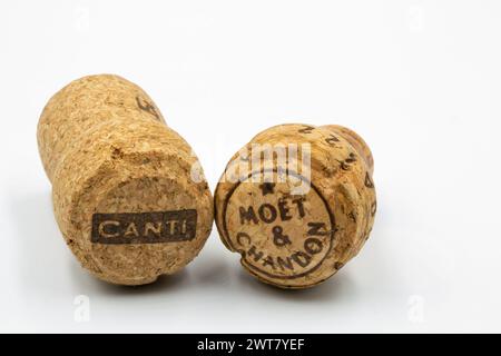 Kyiv, Ukraine - June 18, 2022: Studio shoot of bottle corks champagne Moet and Chandon and Canti sparkling wine closeup on white. Stock Photo