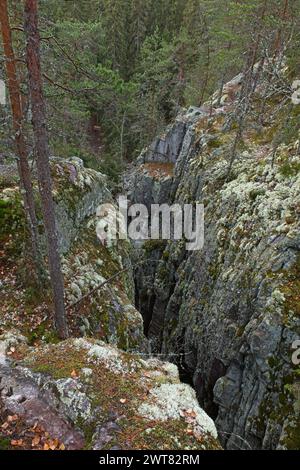 Pirunpesä (Devil´s Nest) is a gorge cutting through the quartzite bedrock at Tiirasmaa nature reserve, Hollola, Finland. Stock Photo