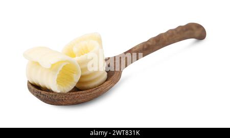 Tasty butter curls in spoon isolated on white Stock Photo