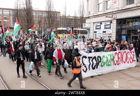 Manchester, UK. 16th Mar, 2024. Palestinian Gaza Protest in Manchester City centre starting in Piccadilly Gardens. Protesters marched for the 23rd consecutive week through the city centre monitored by police. Protesters stopped at Barclays bank which had a notice of temporary closure on its doors. Protesters chanted that Barclays Bank had 'blood on its hands' with regards to the current conflict and drew messages on the pavement. A building on King street was also singled out due to its links with AXA Insurance.  The march held up trams, shoppers  and traffic as thousands marched peacefully. M Stock Photo