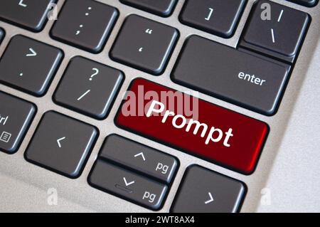 Prompt text on red laptop keyboard. Prompt concept Stock Photo