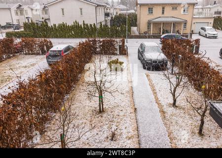 Beautiful spring scene amidst a snowfall on the villas in the community. Sweden. Stock Photo