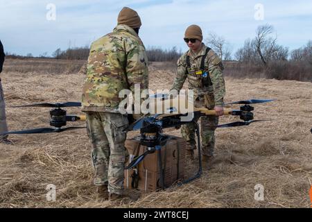 Fort Drum, United States. 03 May, 2024. U.S Army soldiers from the 10th Mountain Division prepare to send a cargo of Meals, Ready-to-Eat using a TRV 150, Tactical Resupply Vehicle, during training at Fort Drum, March 5, 2024, in Fort Drum, New York. The new electric supply drones can deliver up to 440-pounds of payload during battlefield conditions.  Credit: SFC Neysa Canfield/U.S Army/Alamy Live News Stock Photo