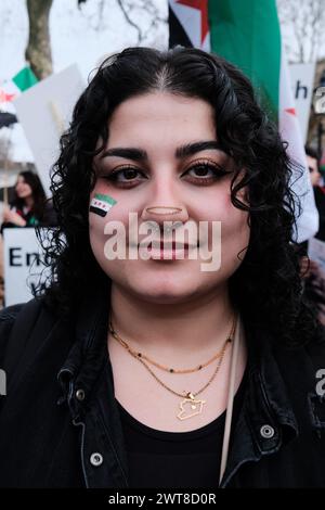 London, UK. 16th Mar, 2024. The Anniversary of the Syrian Revolution is commemorated by the Syria Solidarity Campaign at Downing Street. The event, echoing the sentiment 'We Would Rather Perish Than Be Ruled By Assad!', highlights the ongoing struggle for democracy and human rights in Syria. Credit: Joao Daniel Pereira/Alamy Live News Stock Photo