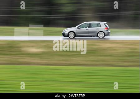 SYMBOL - 16 March 2024, Baden-Württemberg, Rottweil: A VW Golf drives on the B27 federal highway near Rottweil. (Shot with longer exposure time). Photo: Silas Stein/dpa Stock Photo