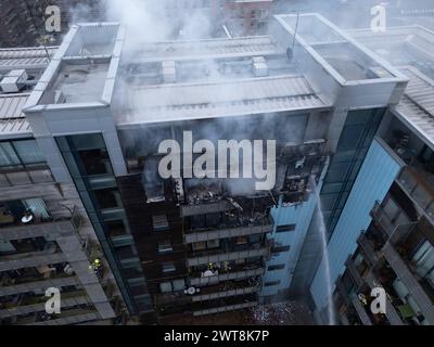 Edinburgh,  Scotland, UK. 14th March, 2024.  Aerial views of fire in apartment building at Breadalbane Street and Anderson Place in Leith, Edinburgh t Stock Photo