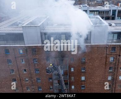 Edinburgh,  Scotland, UK. 14th March, 2024.  Aerial views of fire in apartment building at Breadalbane Street and Anderson Place in Leith, Edinburgh t Stock Photo