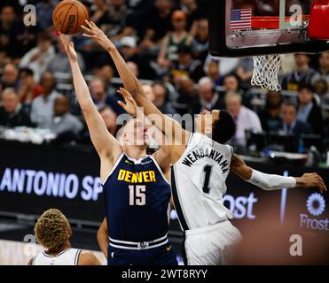 March 15, 2024: Denver Nuggets center Nikola Jokic (15) shoots over San Antonio Spurs center Victor Wembanyama (1) during an NBA game on March 15, 2024. (Credit Image: © Scott Coleman/ZUMA Press Wire) EDITORIAL USAGE ONLY! Not for Commercial USAGE! Stock Photo