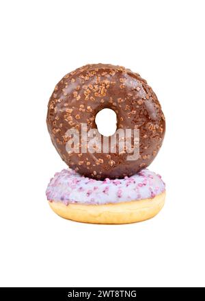 Two donuts with fruit and chocolate glaze on top of each other on a white background Stock Photo