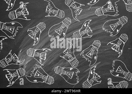 Set of broken down light bulbs hand drawn on a blackboard. Uninspired or motivation, burnout or exhausted from crisis, no new idea or inspiration conc Stock Photo