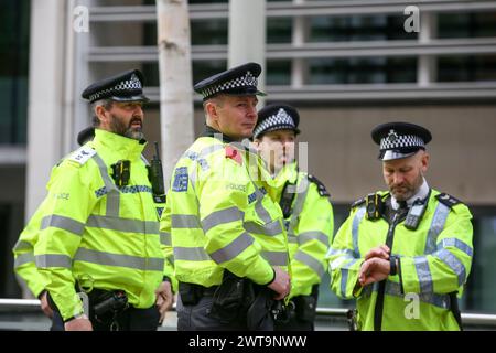 London, UK. 16th Mar, 2024. Police officers stand outside Home Office during an Anti-Racism rally ahead of the UN Anti Racism Day. Credit: SOPA Images Limited/Alamy Live News Stock Photo