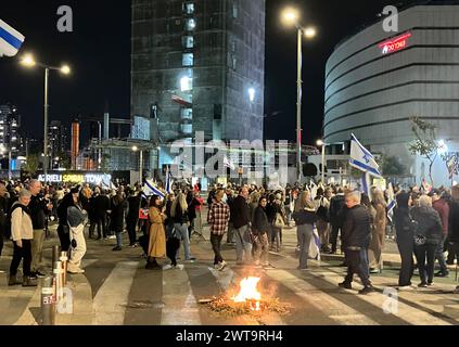 Tel Aviv, Israel. 16th Mar, 2024. Relatives and supporters of Israeli hostages held by the Islamist Hamas in the Gaza Strip block a road and set fire to the street during a rally calling for the release of hostages held by the Islamist Hamas and against Prime Minister Netanyahu's government. Credit: Cindy Riechau/dpa/Alamy Live News Stock Photo