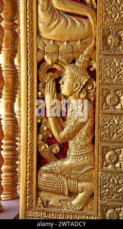 Ornate carving in Buddhist Temple -  Luang Prabang Laos. Luang Prabang is a UNESCO world hertitage listed city in the North of Laos and is becoming a Stock Photo