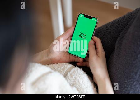 Japan. 17th Mar, 2024. In this photo illustration, the Uber Eats app seen displayed on a mobile phone. Uber Eats started using self-driving robots for delivering food orders to customers in Tokyo in March 2024. Credit: SOPA Images Limited/Alamy Live News Stock Photo
