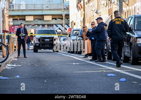 Philadelphia, United States. 16th Mar, 2024. Police block off roads and gather evidence as they investigate a shooting near the Kensington area in Philadelphia. One person was killed and one person wounded in a double shooting on East Lippincott Street in Philadelphia. A 25-year-old Hispanic male died from a gunshot wound to the chest and a 23-year-old Hispanic female was wounded by a graze wound to the left arm and is in stable condition. The shooting happened at approximately 3:27 PM, Saturday afternoon. (Photo by Kyle Mazza/SOPA Images/Sipa USA) Credit: Sipa USA/Alamy Live News Stock Photo