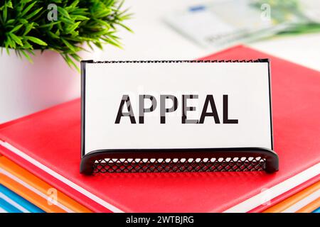 Word APPEAL on white business cards in delivery on a light background Stock Photo