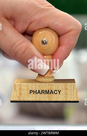 Symbol photo, woman's hand with stamp, inscription: Pharmacy, Studio Stock Photo