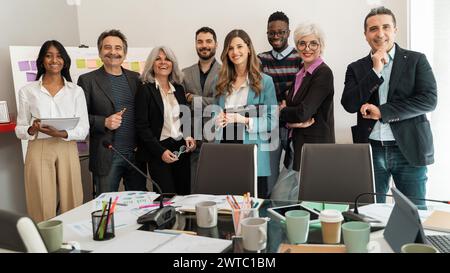 Diverse business professionals gathering for a strategic meeting, embodying teamwork and inclusivity. Stock Photo