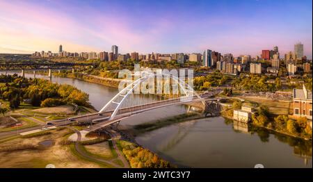 An aerial of a bridge over the river with the city in the background in Edmonton, Alberta, Canada. Stock Photo