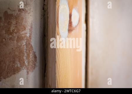 sanded wooden door casing closeup during home renovation. Stock Photo