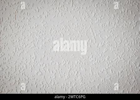 white painted woodchip wallpaper texture pattern backgroung. Stock Photo