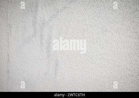 grey painted woodchip wallpaper texture pattern backgroung. Stock Photo