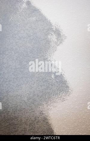 grey painted woodchip wallpaper texture pattern backgroung. Stock Photo
